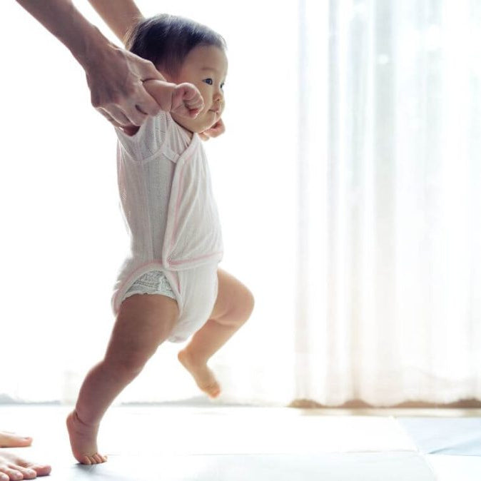 How to Help Your Baby Take Their First Steps: A Parent's Guide